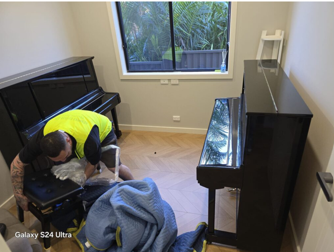 Upright piano movers Sydney preparing and protecting an upright piano before transport