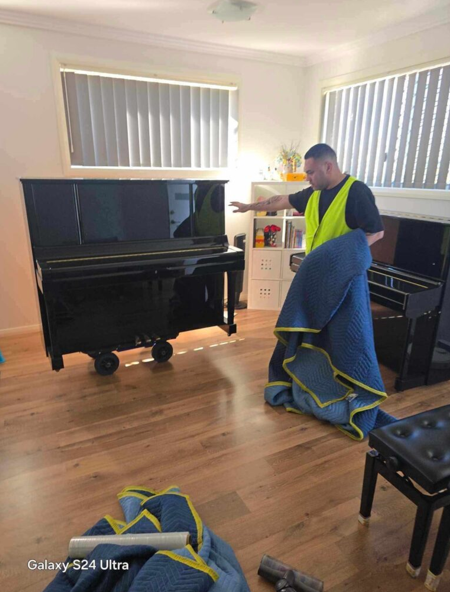 Piano disposal Wollongong piano prepared with protective moving equipment